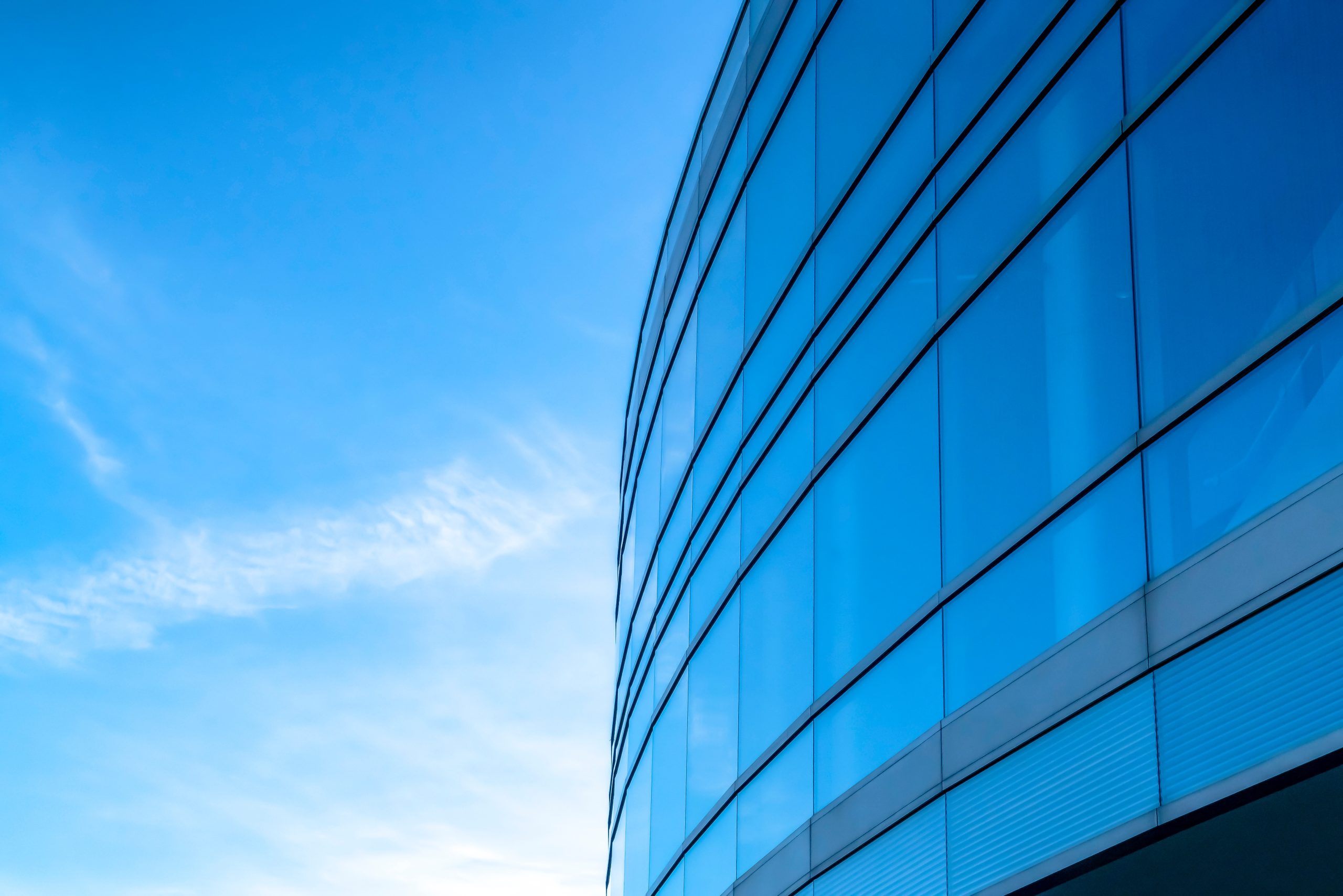 Building exterior with bright blue sky background Dallas Home Inspectors